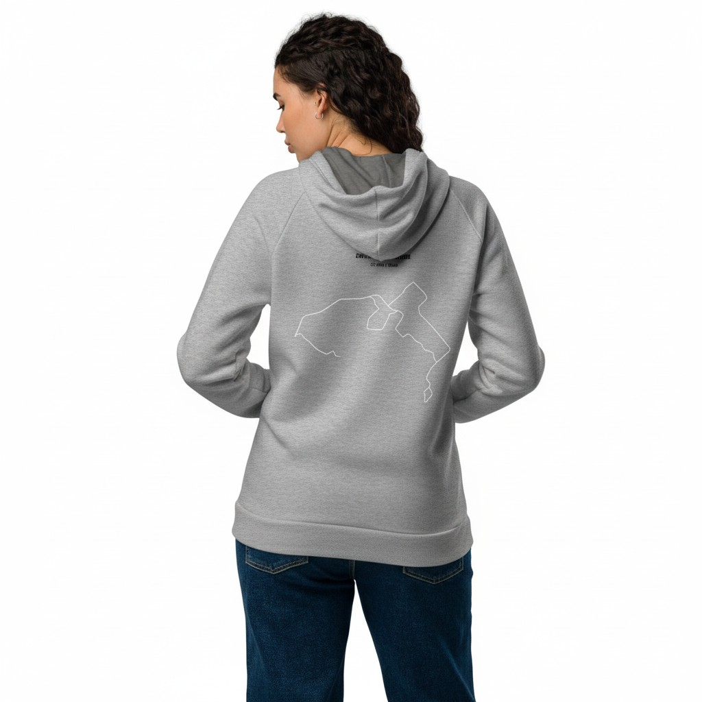 Person wearing a gray hoodie with a logo on the back, standing against a white background