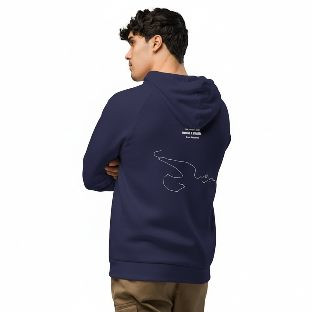Person wearing a navy blue hoodie with a logo on the back, standing against a white background