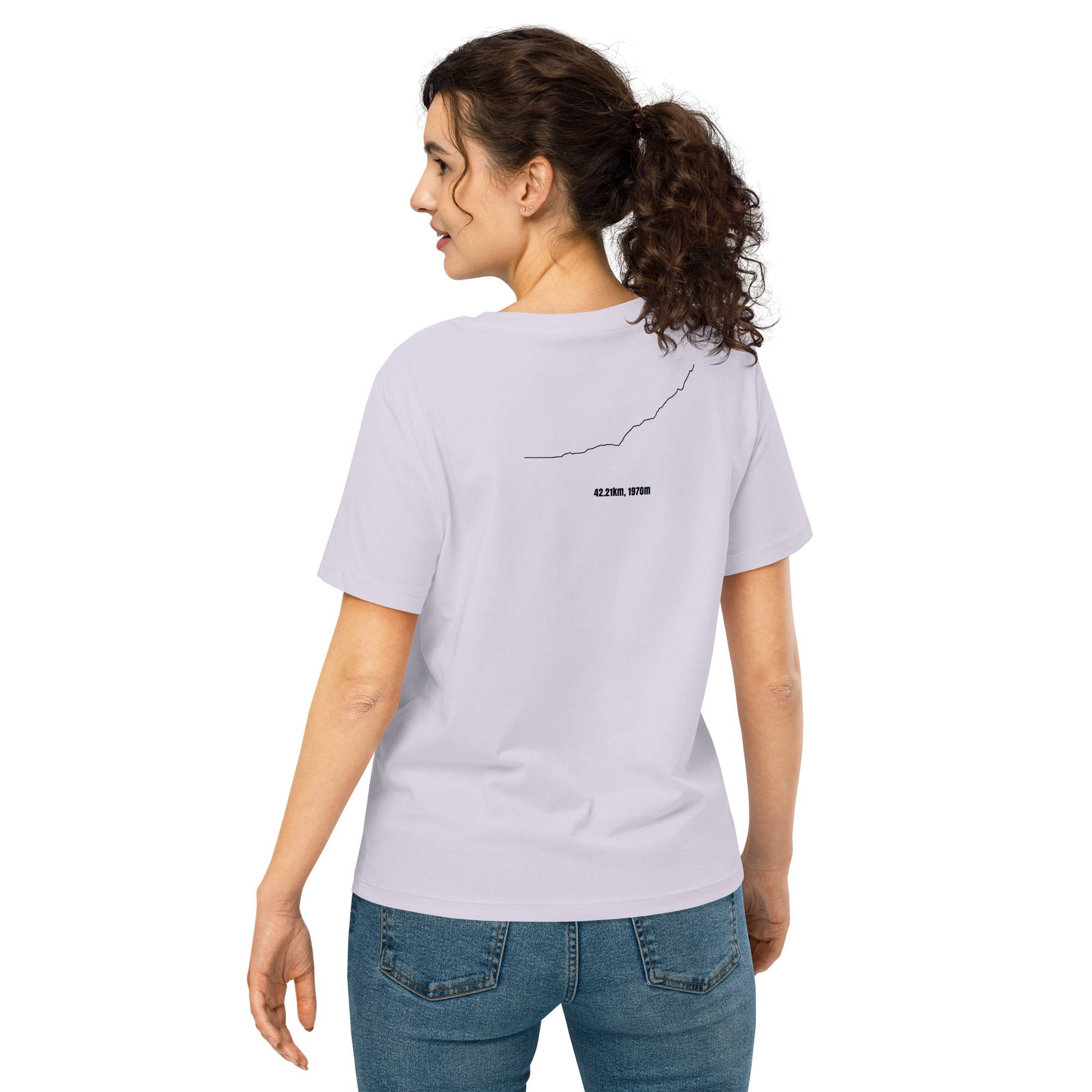Woman wearing a light purple t-shirt with a custom Strava route print on the back, standing against a white background