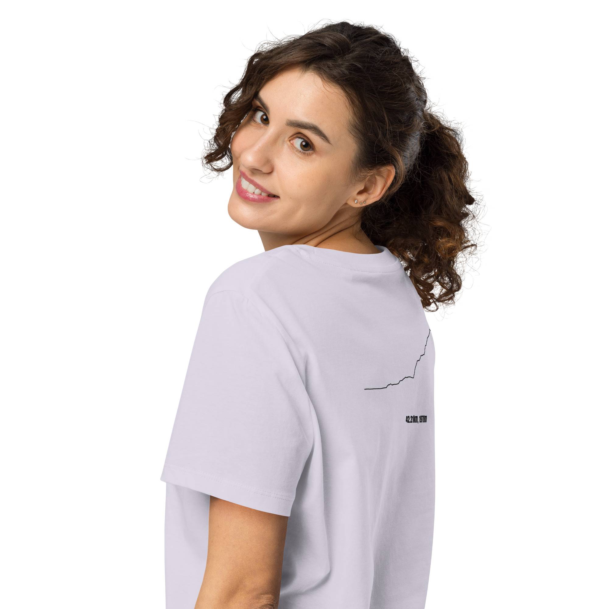 Woman wearing a light gray t-shirt with a custom Strava route print on a white background