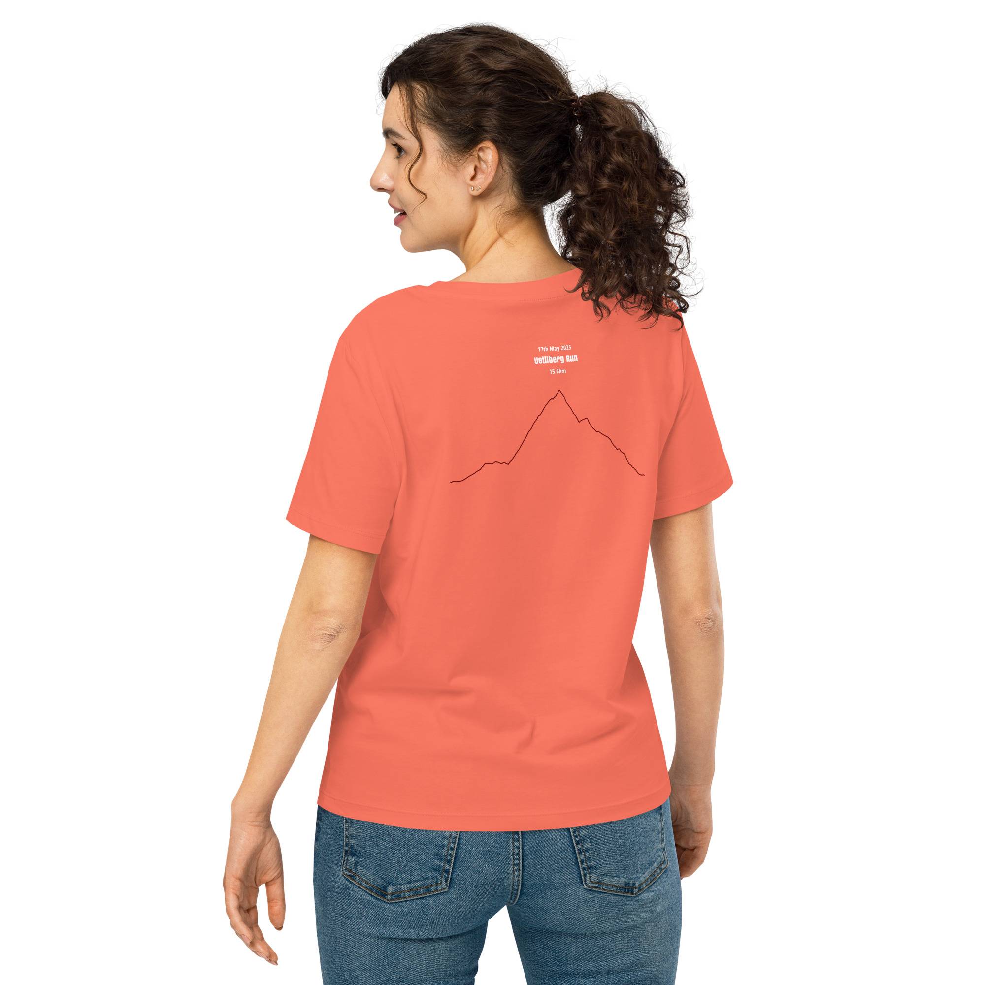 Woman wearing a coral t-shirt with a custom Strava route print graphic on a white background