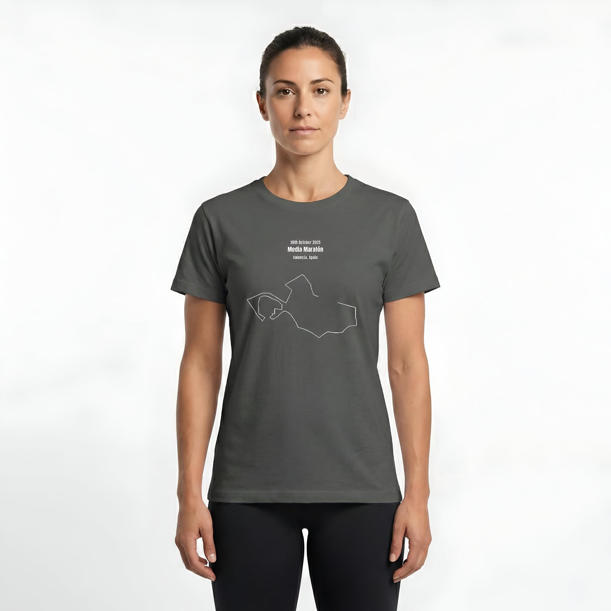 Woman wearing a gray t-shirt with custom Strava route print art design and black shorts on a white background