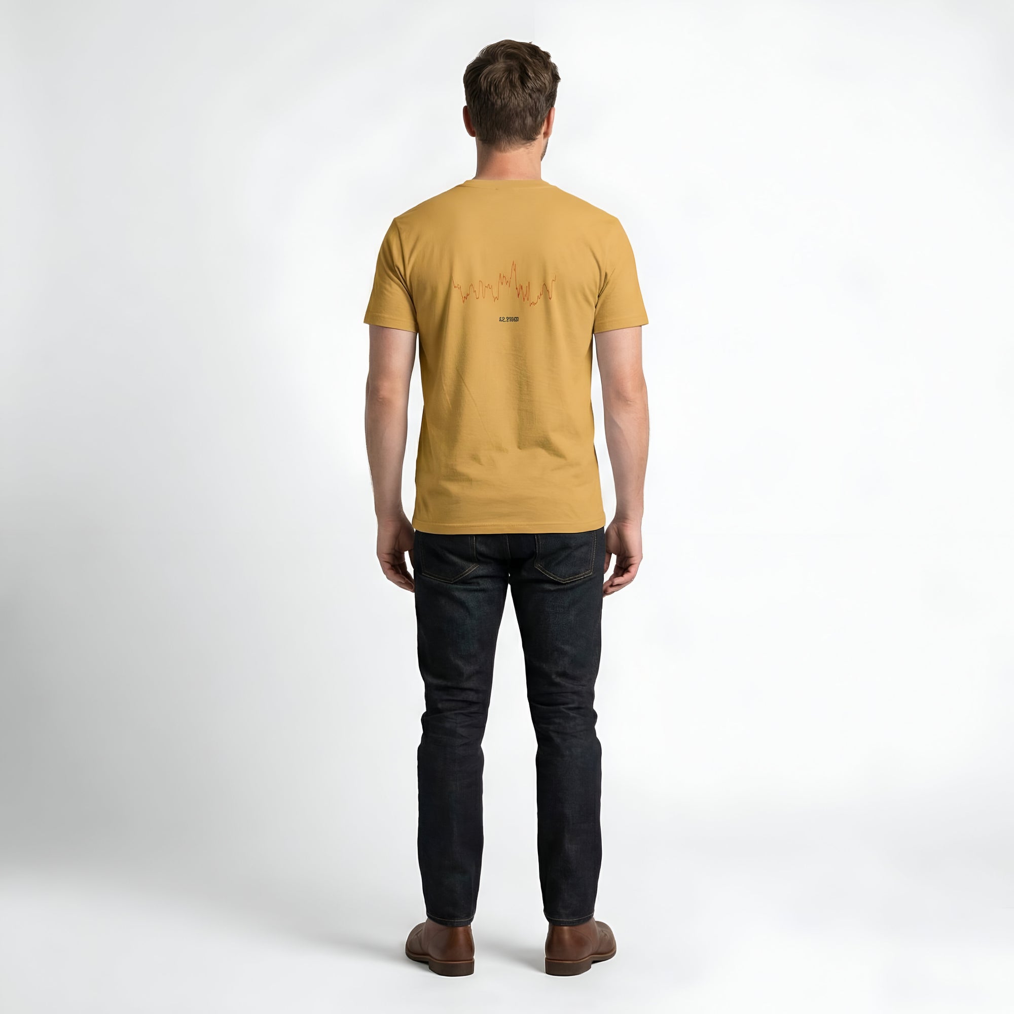 Person wearing a mustard yellow t-shirt with custom Strava route print art design on the back against a white background