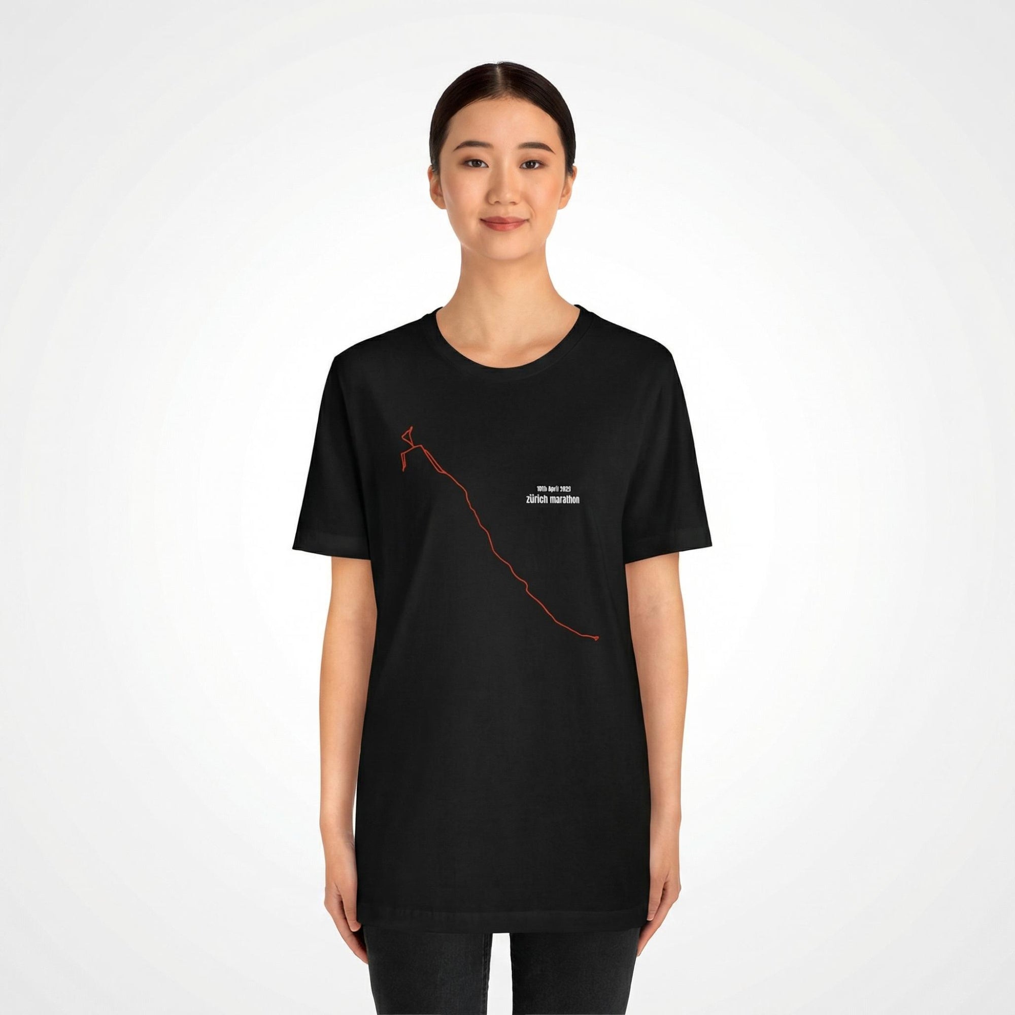 Person wearing a black t-shirt with a custom Strava route print art design on a white background
