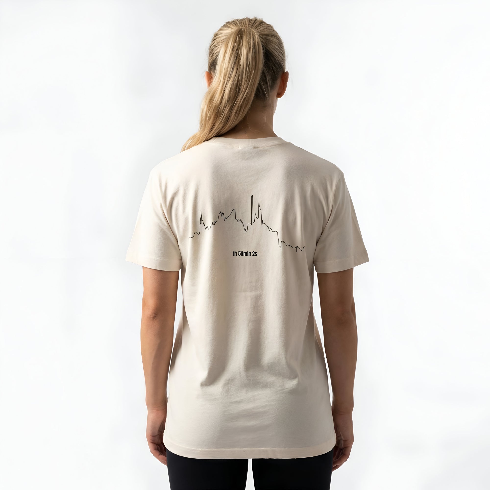 Person wearing a beige t-shirt with custom Strava route print art design on the back against a white background