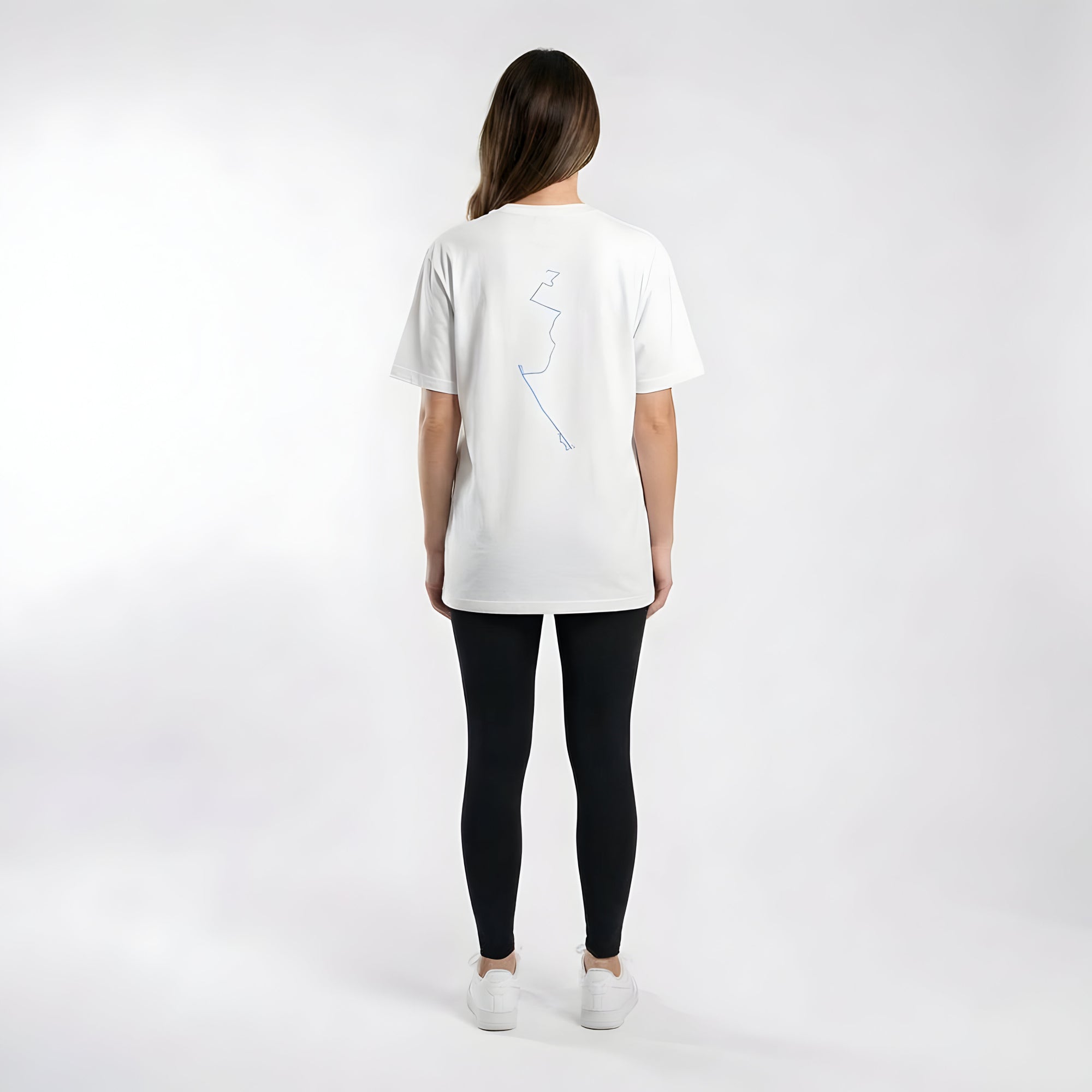 Person wearing a white t-shirt with a custom Strava route print art design on the back against a plain background