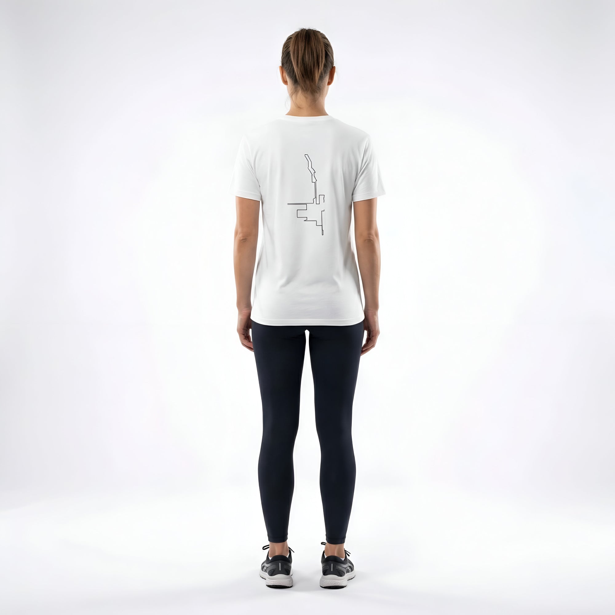 Person wearing a white t-shirt with a custom Strava route print art design on the back, standing against a white background