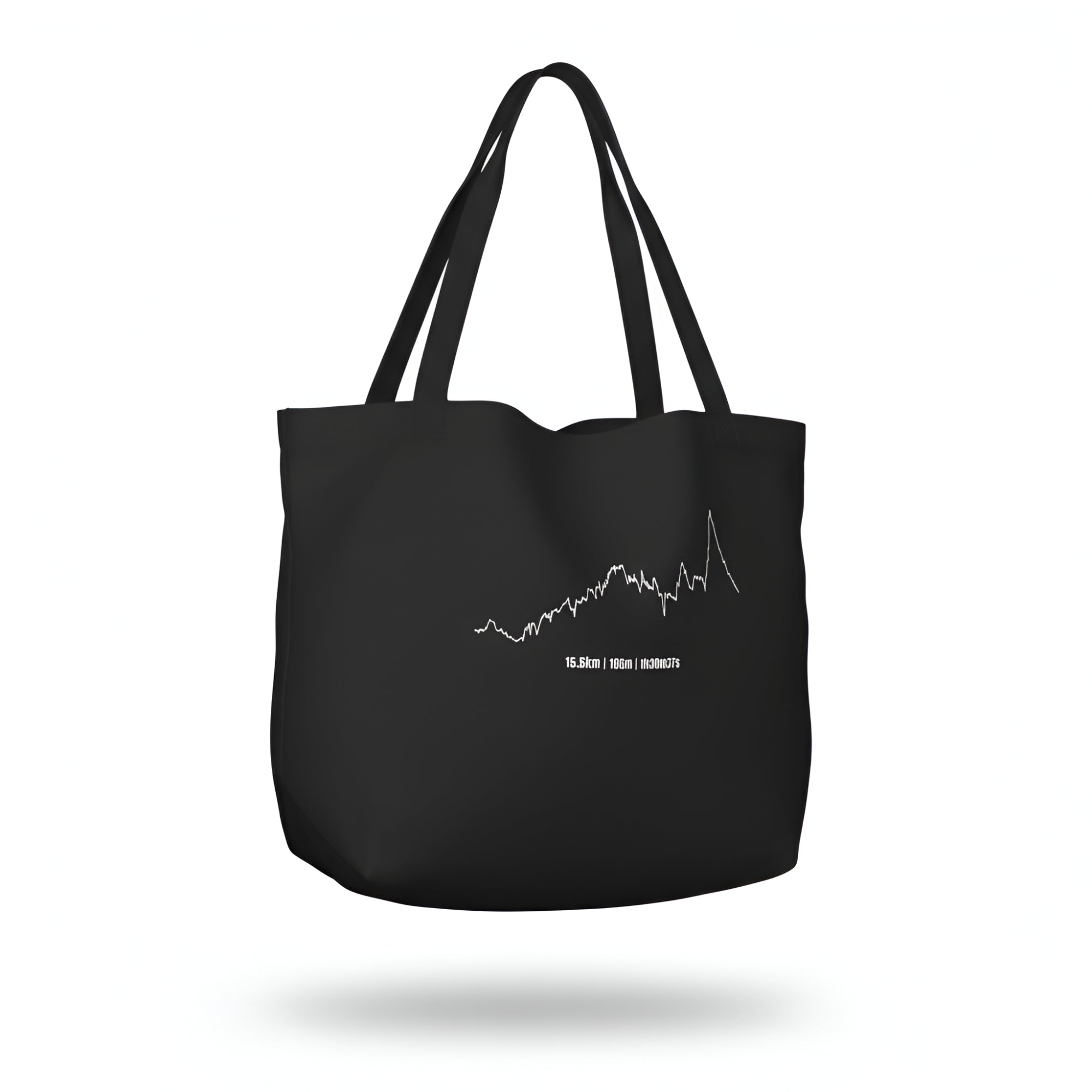 Black tote bag with a white custom Strava route print art design on a white background