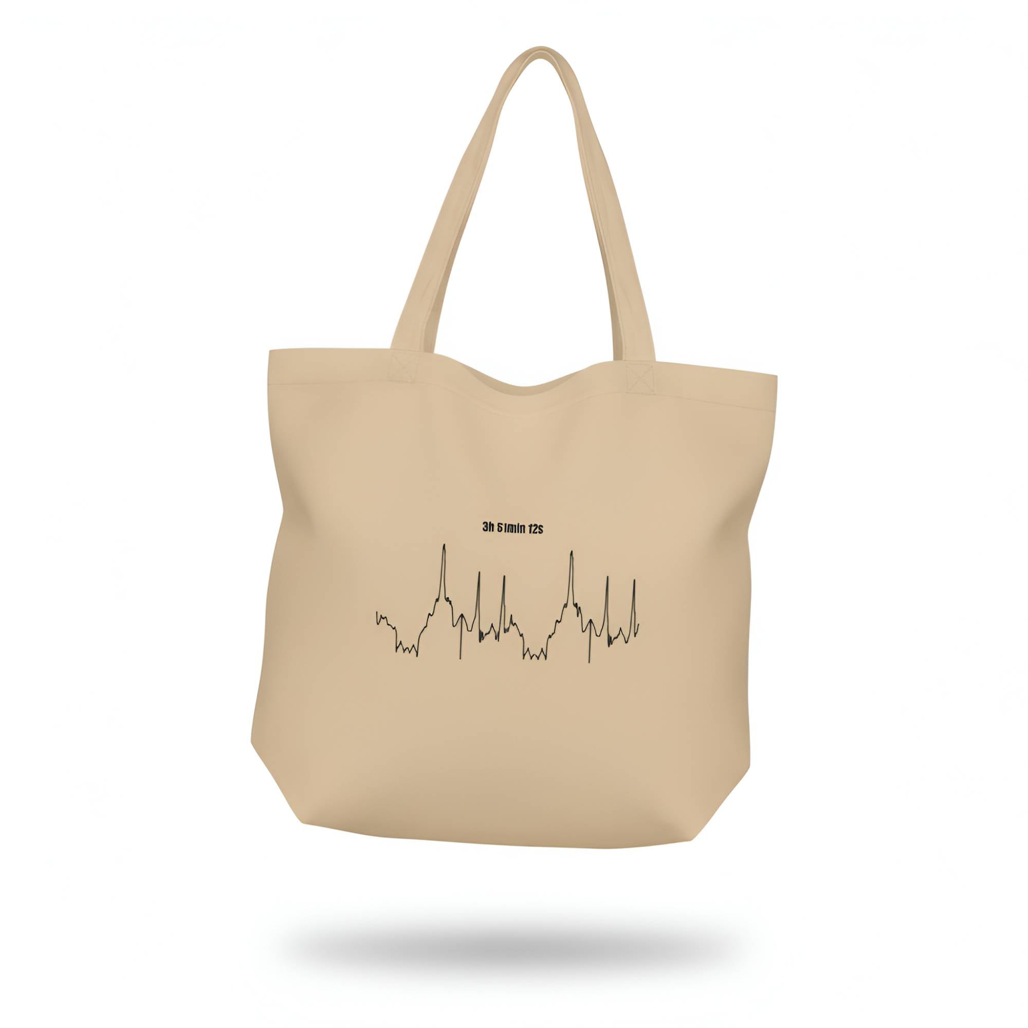 Beige tote bag with a black custom Strava route print art design and text on a white background