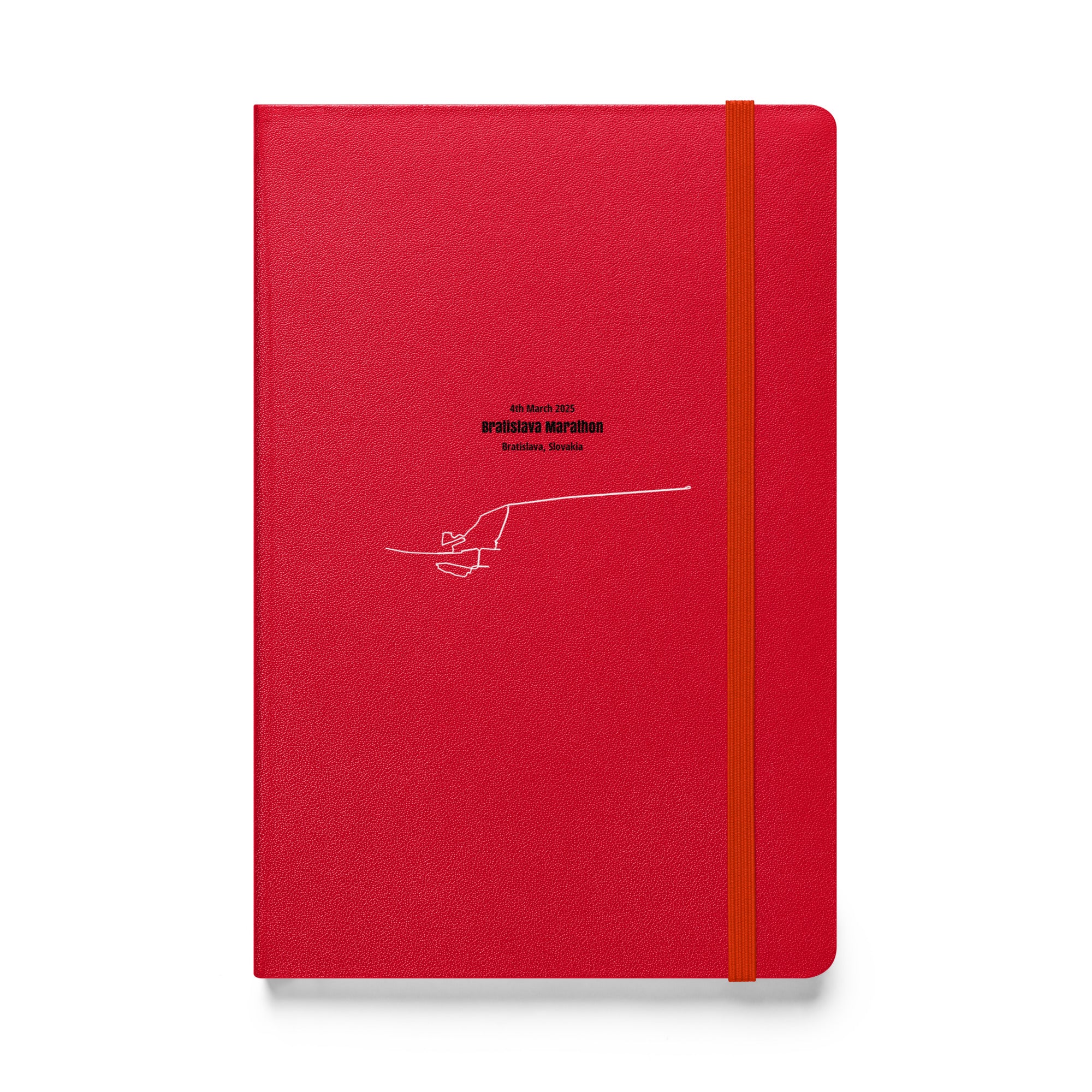 Red notebook with a white custom Strava route print art on a white background