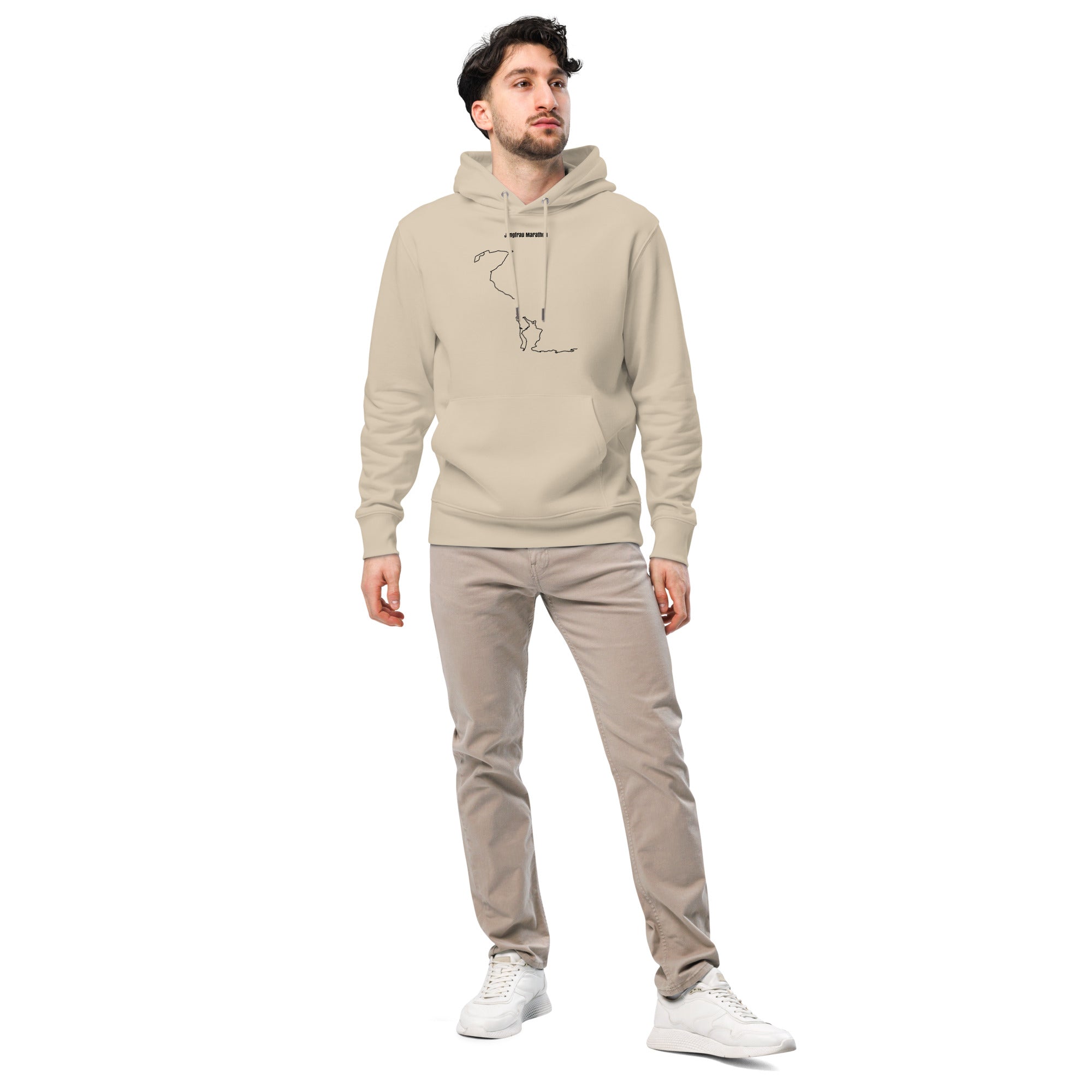 Man wearing a beige hoodie with custom Strava route print art and pants on a white background