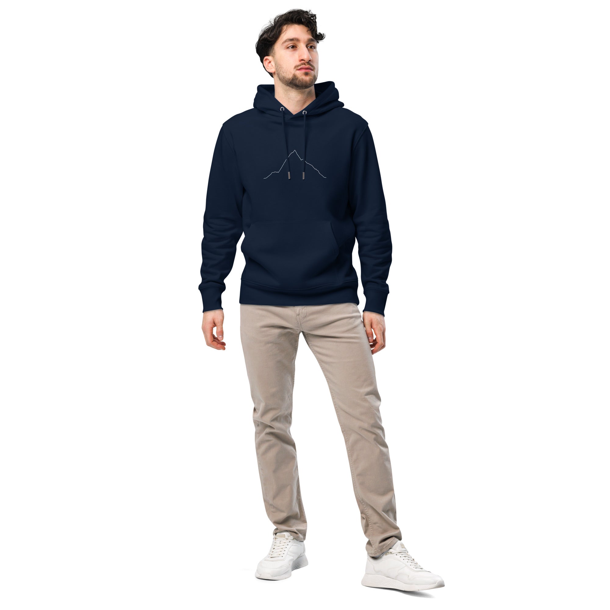 Man wearing a navy hoodie with custom Strava route print art and beige pants on a white background
