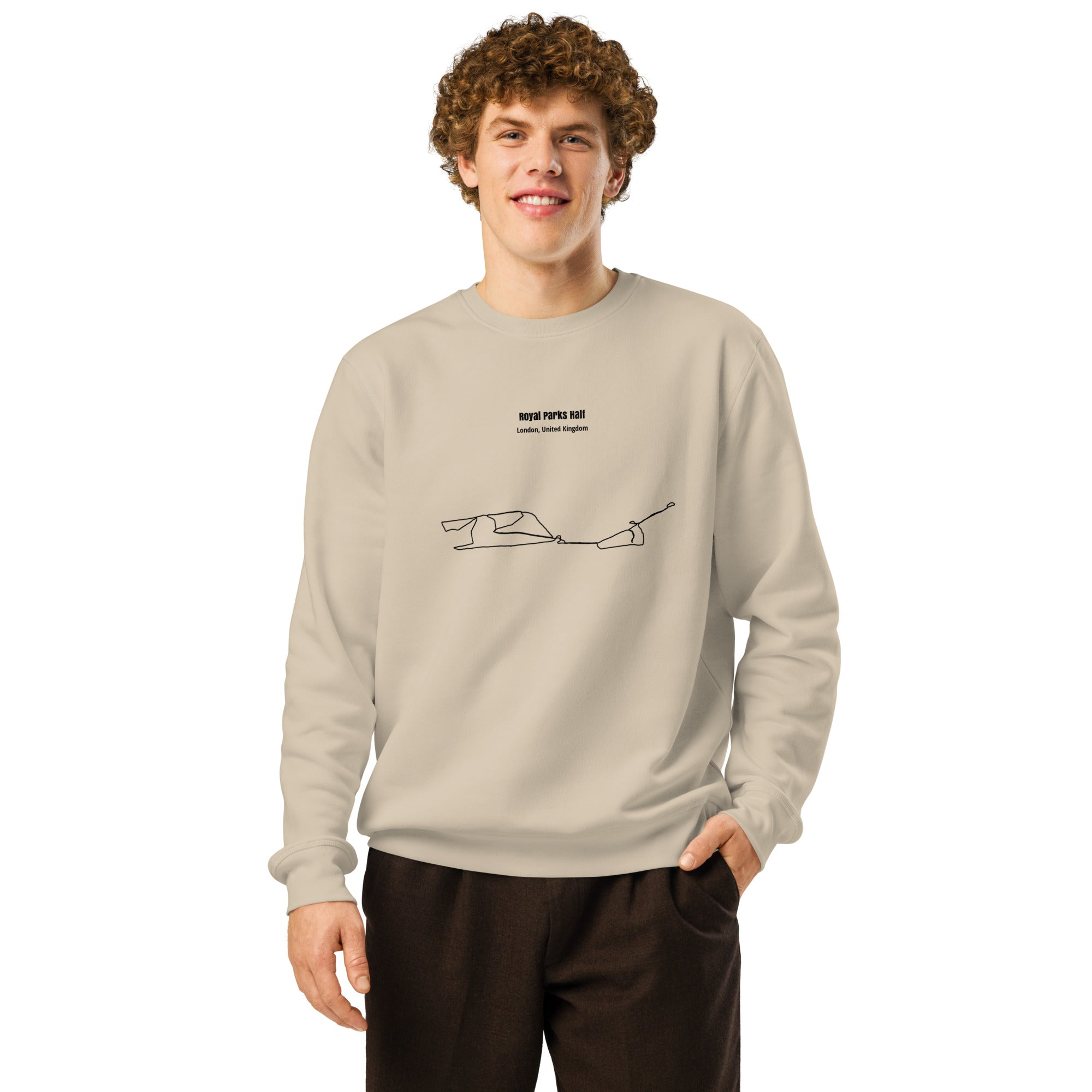 Person wearing a beige sweatshirt with custom Strava route print art design on a white background