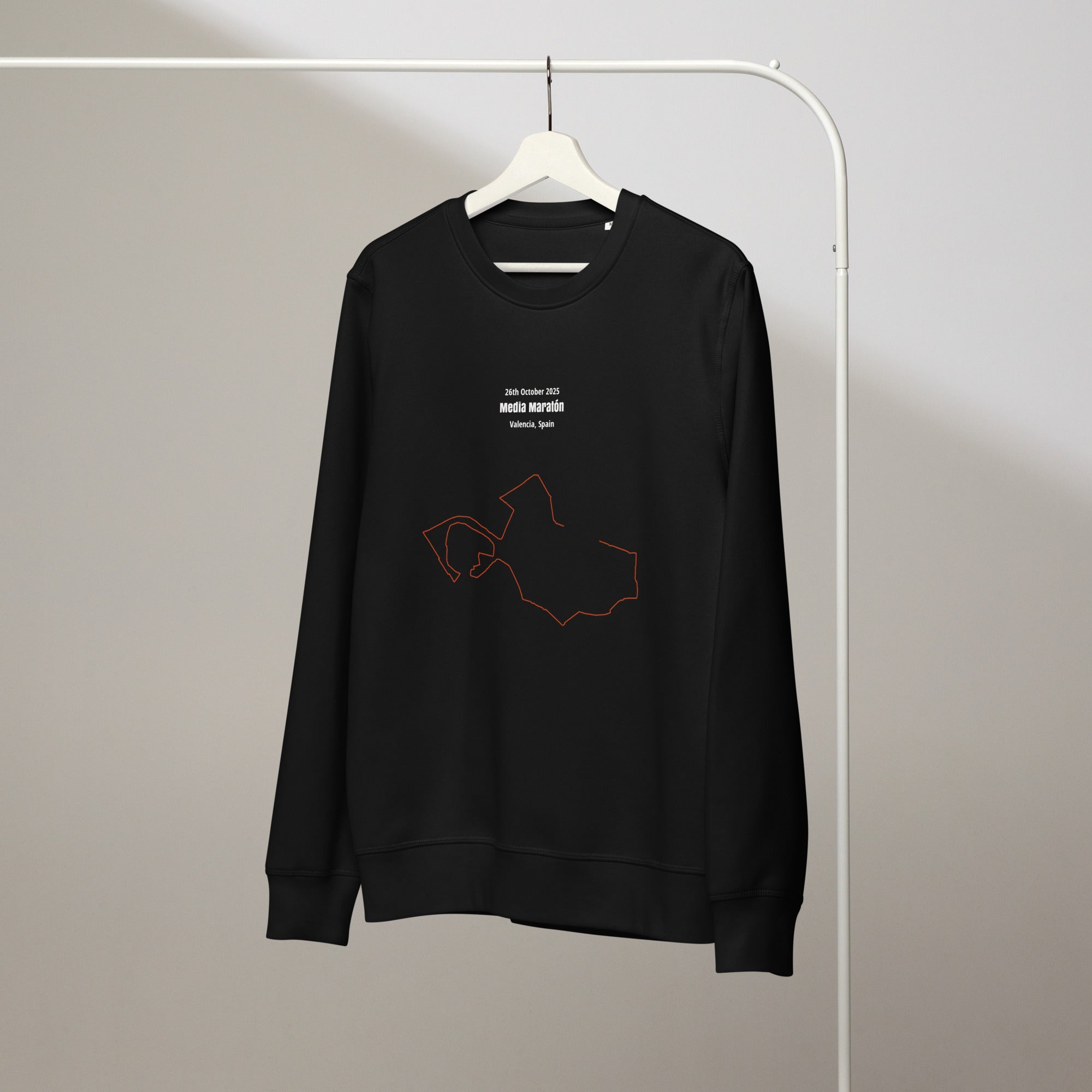 Black sweatshirt with custom Strava route print art design on a hanger against a plain background