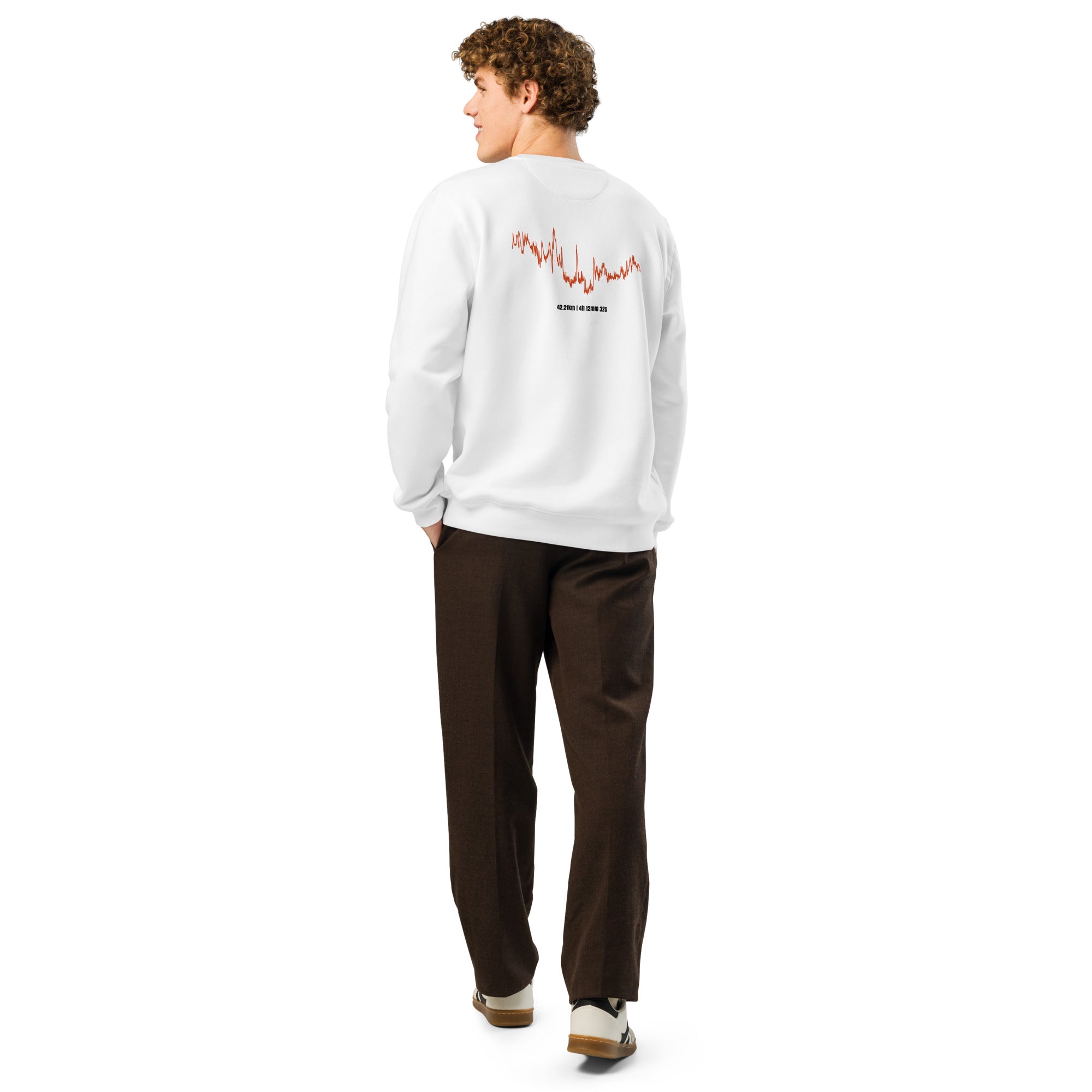 Person wearing a white sweatshirt with red custom Strava route print art on the back, standing against a white background