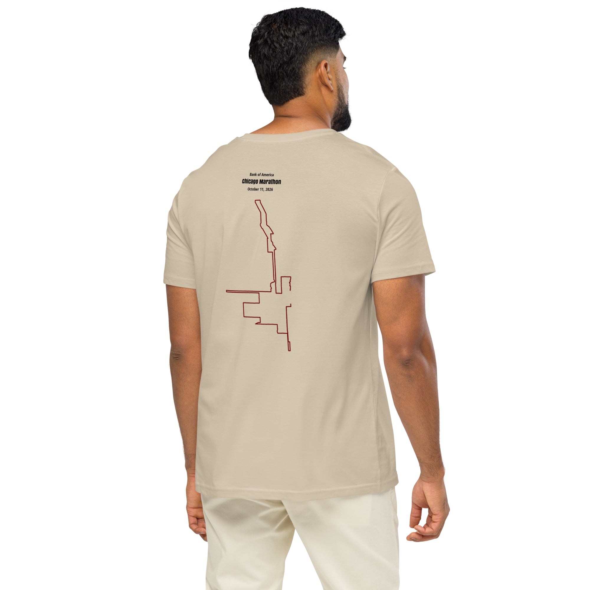 Man wearing a beige t-shirt with a custom Strava route print art design on the back, standing against a white background