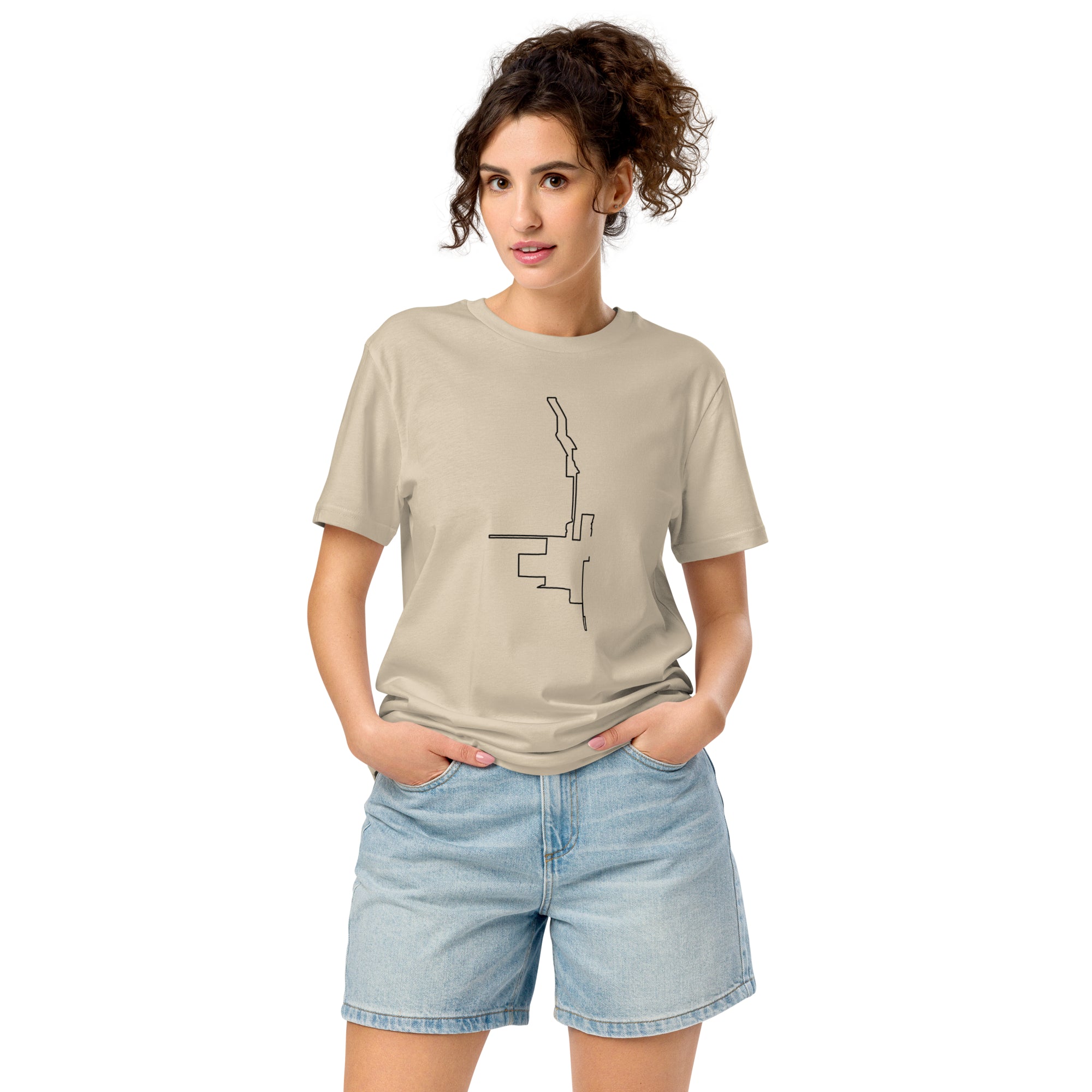 Woman wearing a beige t-shirt with a black custom Strava route print art drawing on a white background