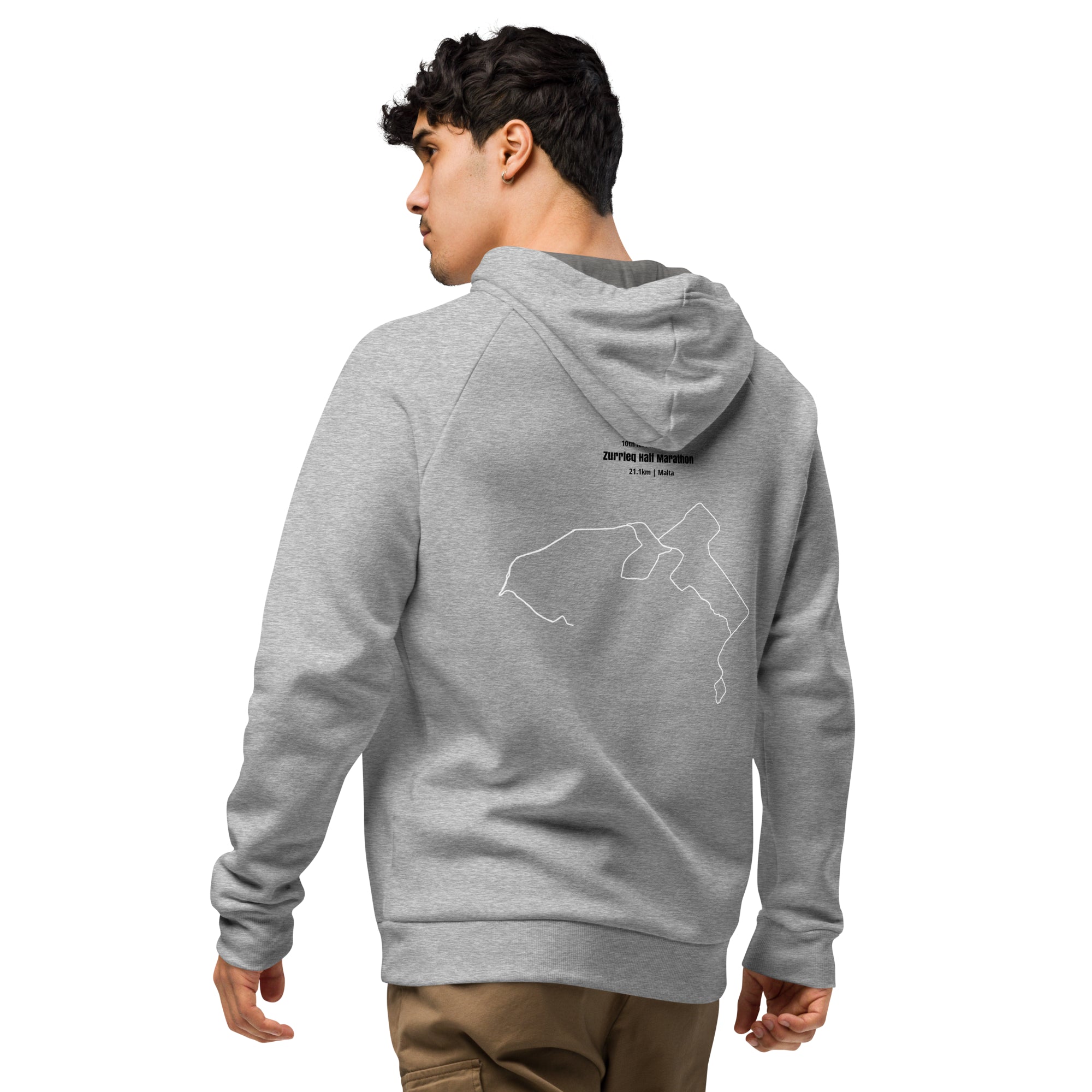 Person wearing a gray hoodie with a logo on the back and custom Strava route print, standing against a white background