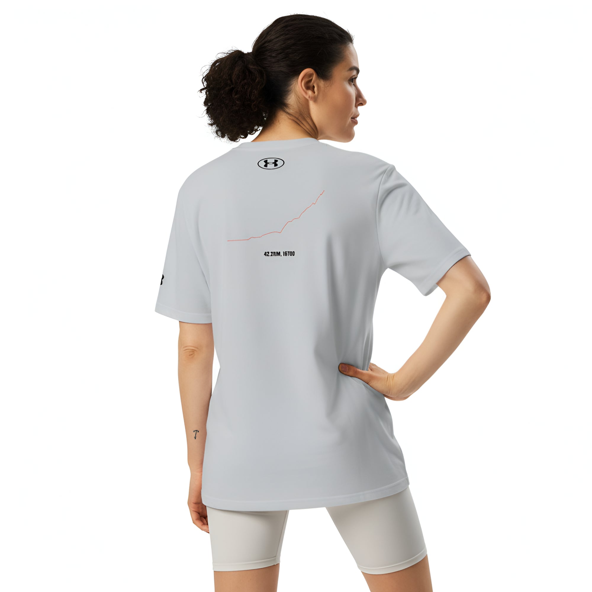 Woman wearing a light gray sports outfit with a brand logo and custom Strava route print on a white background