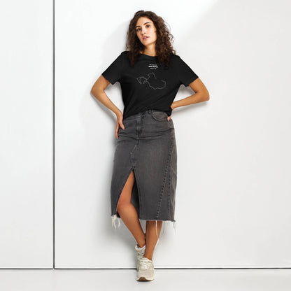 Woman wearing a black t-shirt with custom Strava route print and gray denim skirt on a white background