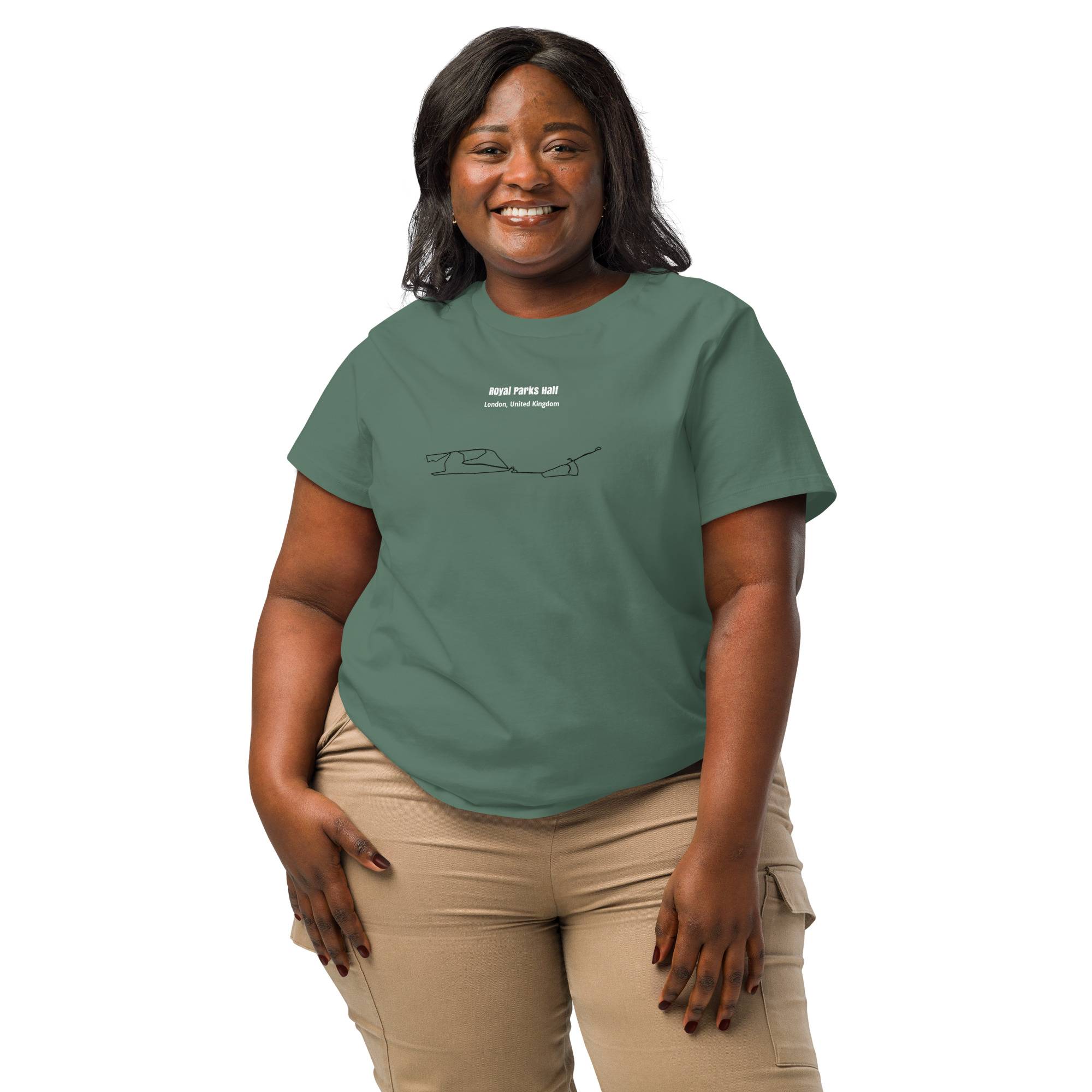 Woman wearing a green t-shirt with text and custom Strava route print graphics on a white background