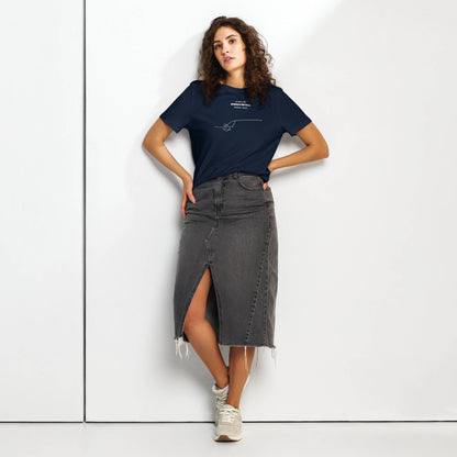 Woman wearing a navy t-shirt with custom Strava route print and gray denim skirt on a white background