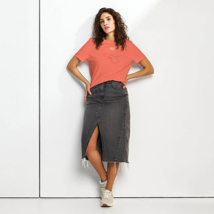 Woman wearing a coral t-shirt with custom Strava route print and black denim skirt on a white background