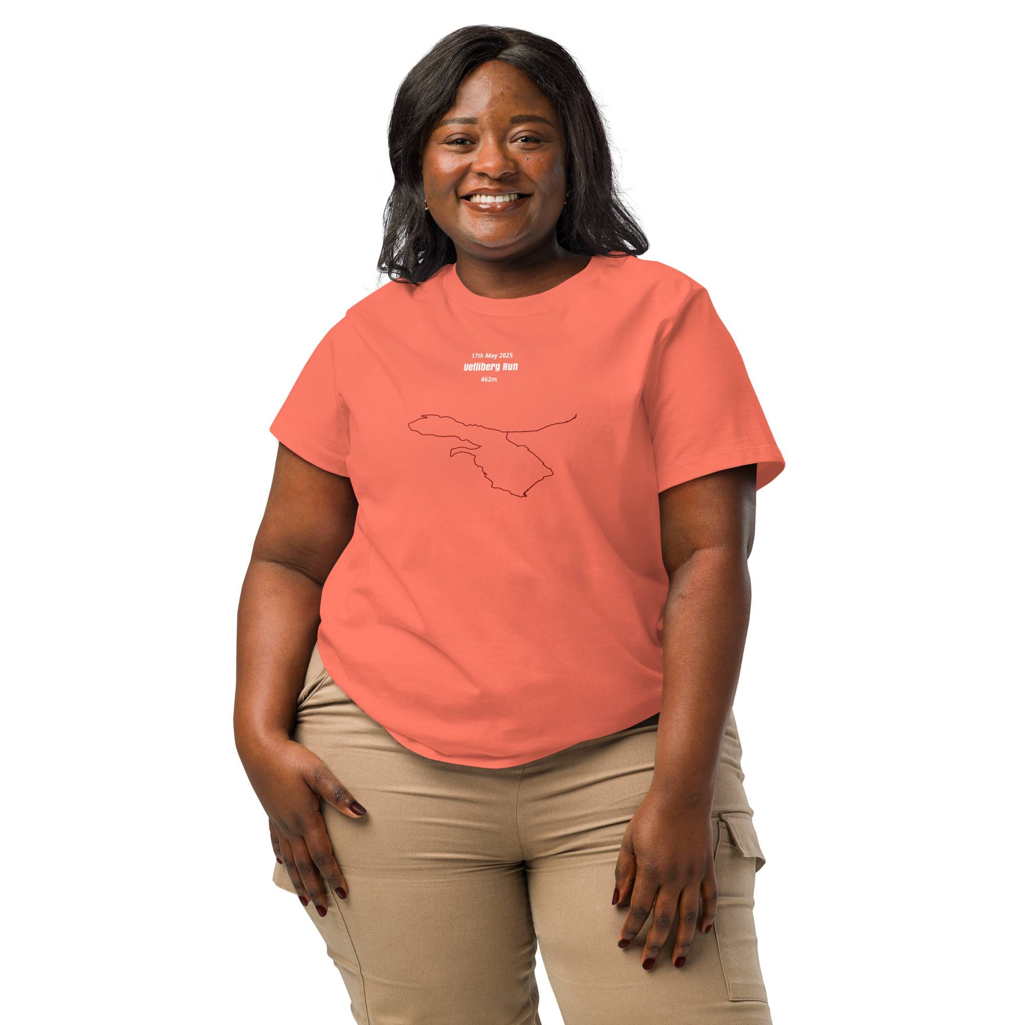 Woman wearing a coral t-shirt with a custom Strava route print design on a white background