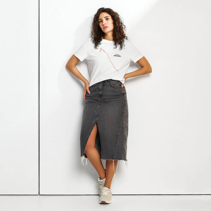 Woman wearing a white t-shirt with custom Strava route print and gray denim skirt against a white background