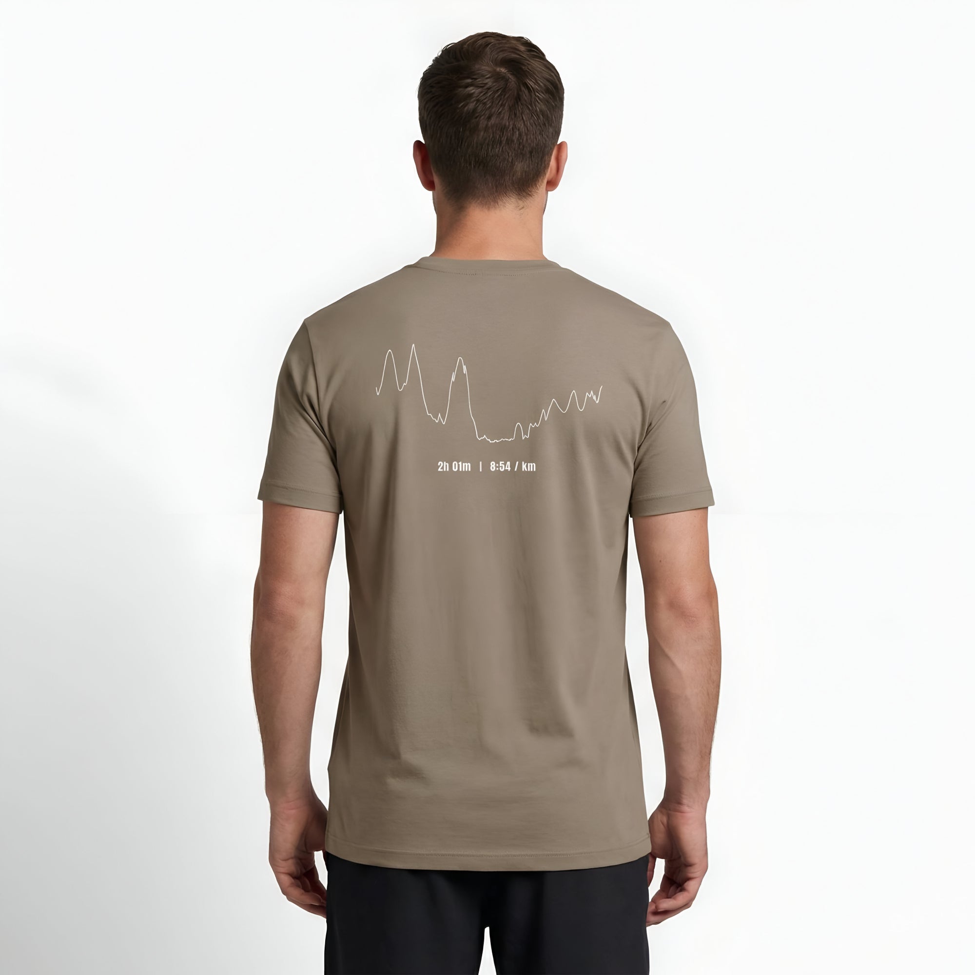 Person wearing a brown t-shirt with custom Strava route print art design on the back against a white background