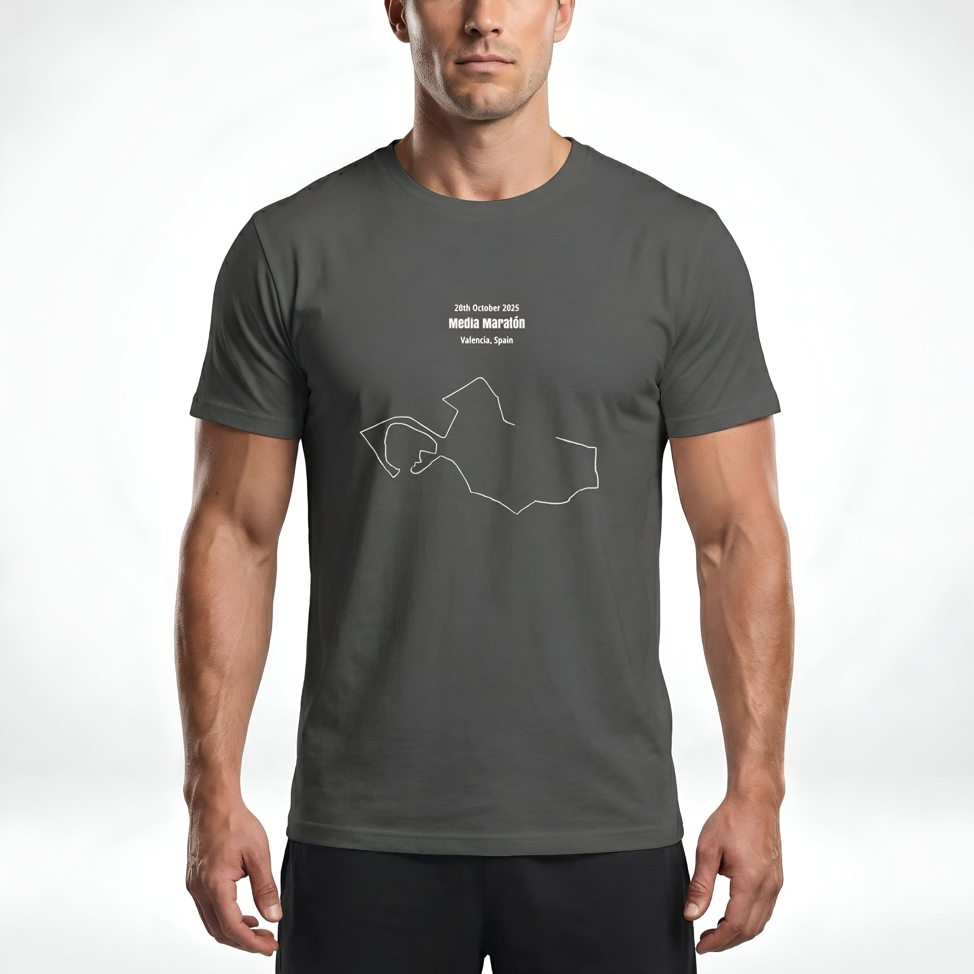 Man wearing a gray t-shirt with custom Strava route print art design and black shorts on a white background