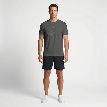 Man wearing a gray t-shirt with custom Strava route print art design and black shorts on a white background
