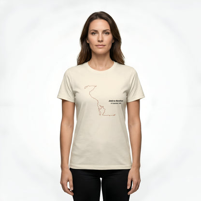 Woman wearing a light beige t-shirt with a black custom Strava route print art design on a white background