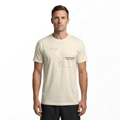 Man wearing a light beige t-shirt with a black custom Strava route print art design on a white background
