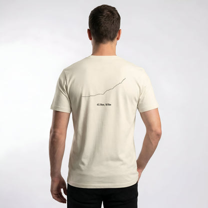 Man wearing a beige t-shirt with custom Strava route print art design on the back against a white background