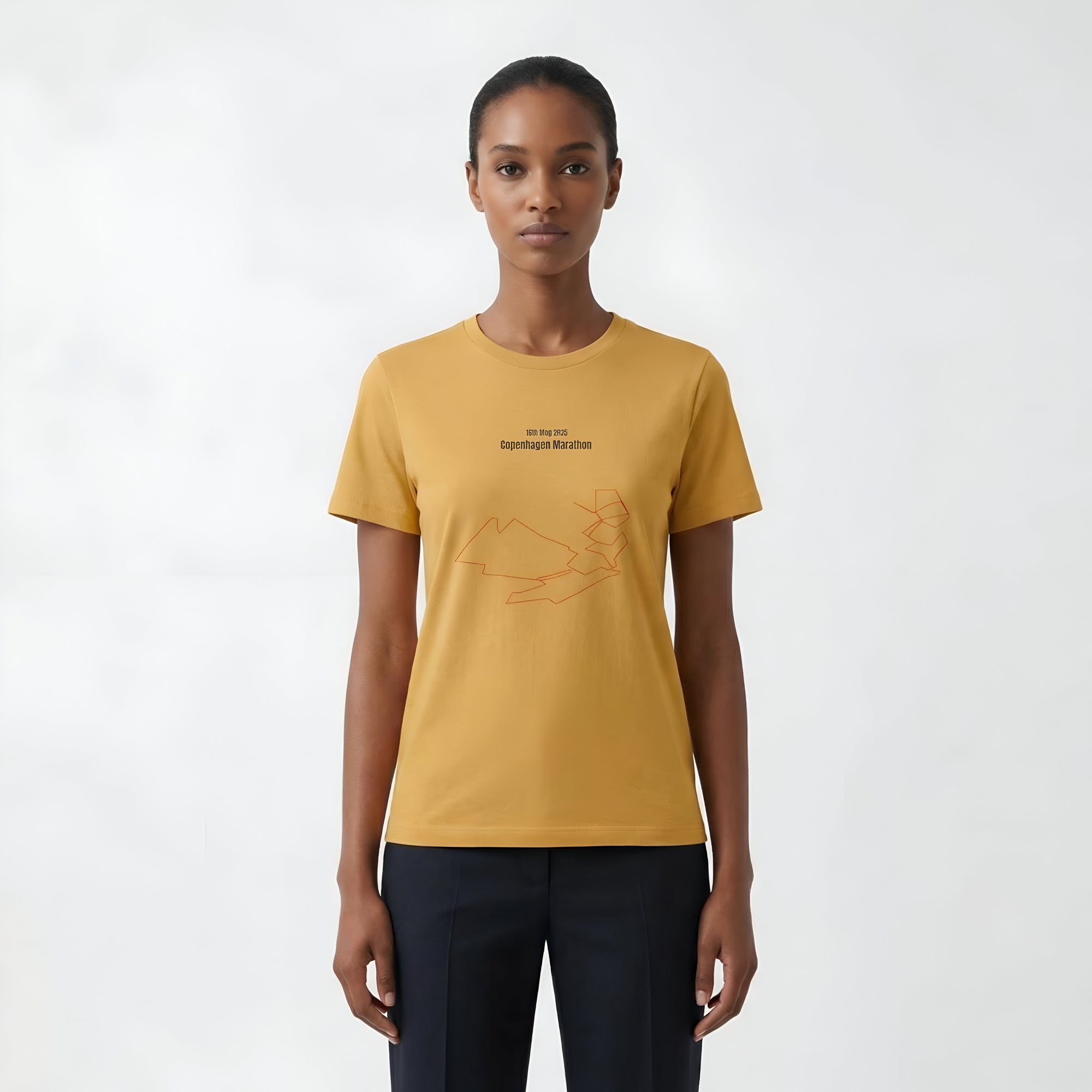 Person wearing a mustard yellow t-shirt with custom Strava route print art design on a white background