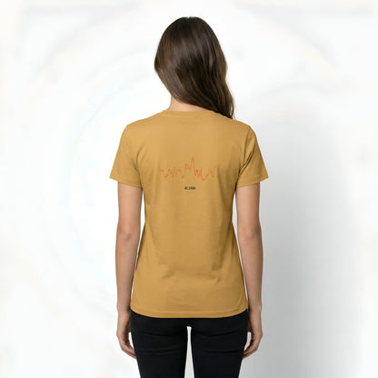 Person wearing a mustard yellow t-shirt with text on the back and custom Strava route print art design against a white background