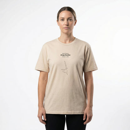 Female model wearing a beige t-shirt with a custom Strava route print art design on a white background