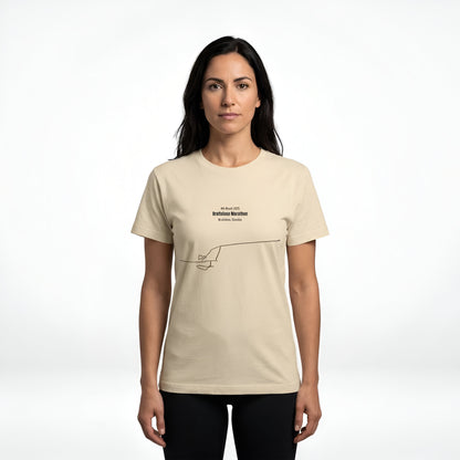 Woman wearing a beige t-shirt with text and custom Strava route print art design on a white background