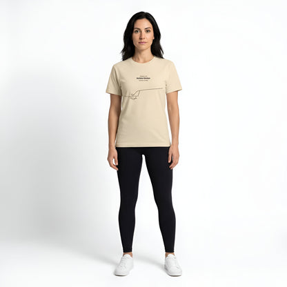 Woman wearing a beige t-shirt with custom Strava route print art and black leggings on a white background