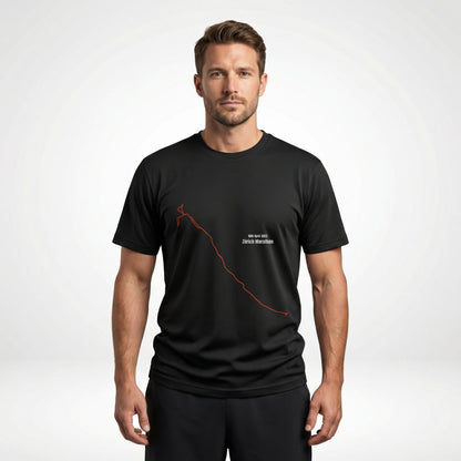 Man wearing a black t-shirt with a custom Strava route print art design on a white background