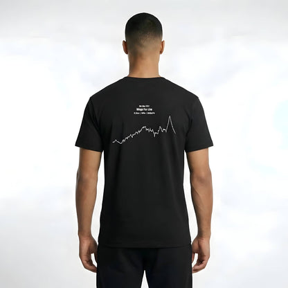 Person wearing a black t-shirt with a white custom Strava route print art on the back against a white background