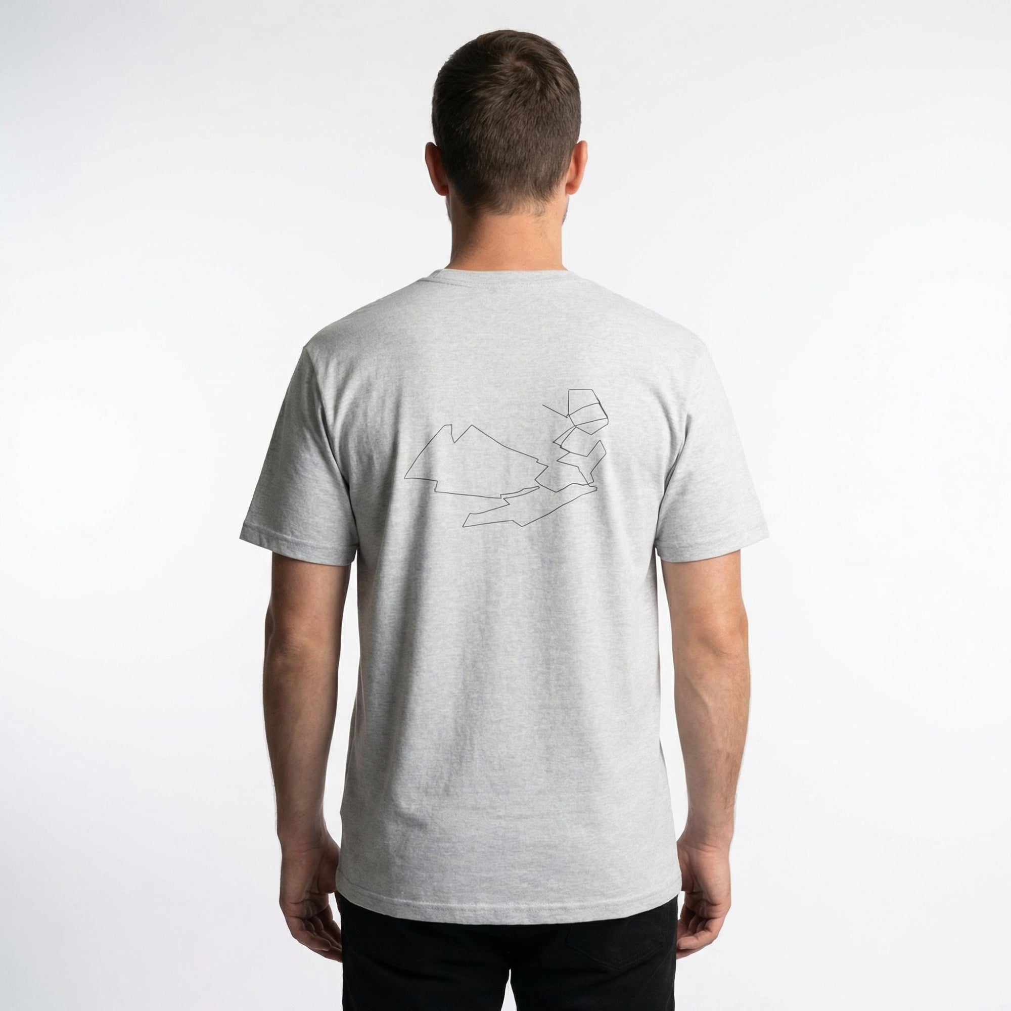 Man wearing a gray t-shirt with a custom Strava route print art design on the back against a white background