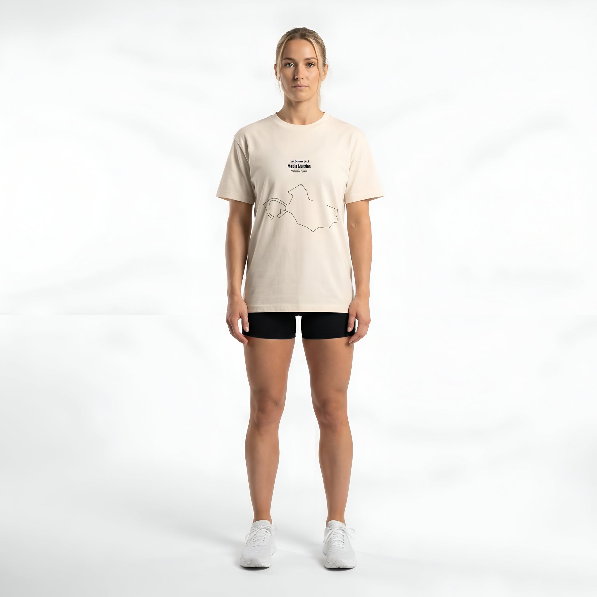 Person wearing a beige t-shirt with a custom Strava route print art design on a white background