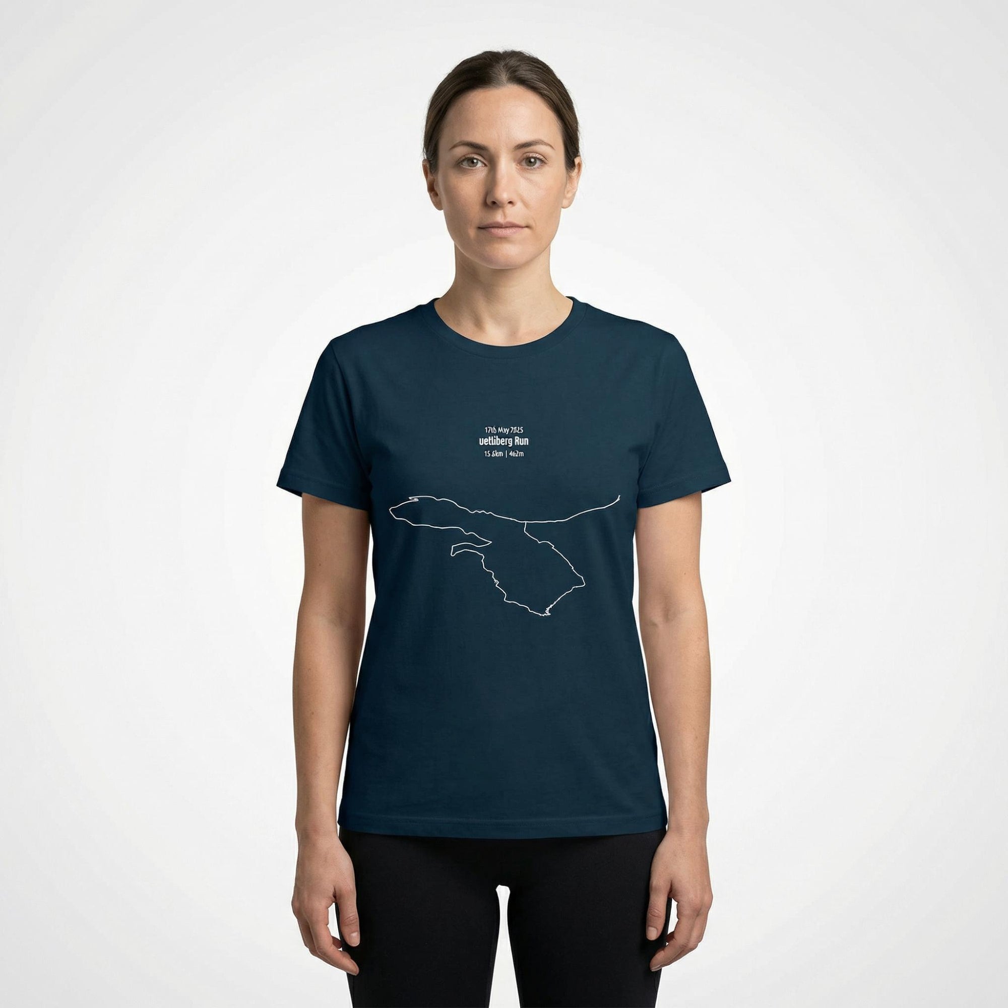 Woman wearing a navy blue t-shirt with a custom Strava route print art design on a white background
