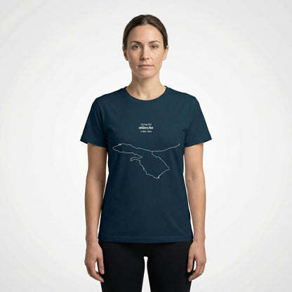 Woman wearing a navy blue t-shirt with a custom Strava route print art design on a white background