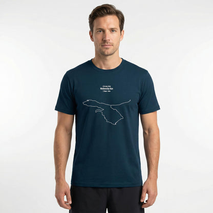 Man wearing a navy blue t-shirt with a custom Strava route print art design on a white background