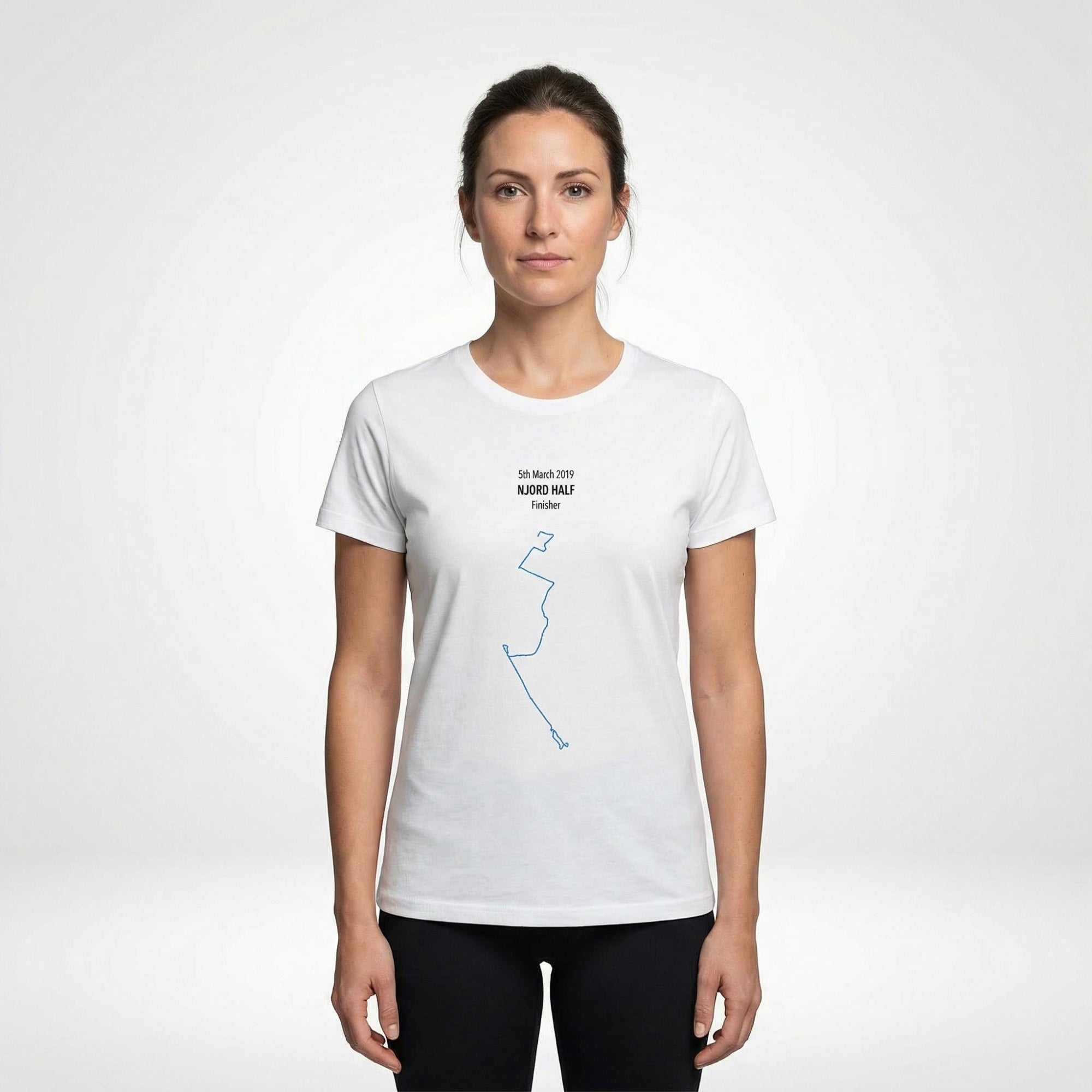 Woman wearing a white t-shirt with a custom Strava route print art design on a white background