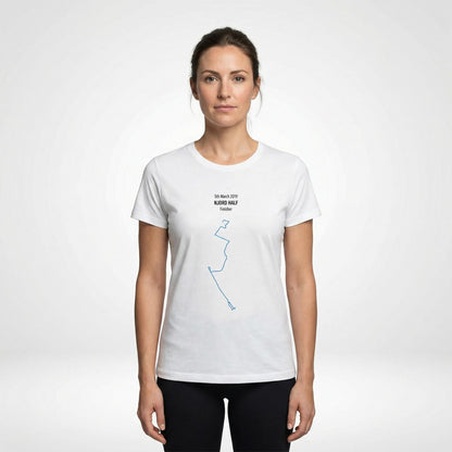 Woman wearing a white t-shirt with a custom Strava route print art design on a white background
