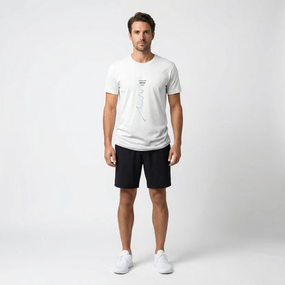 Man wearing a white t-shirt with custom Strava route print art and black shorts on a white background